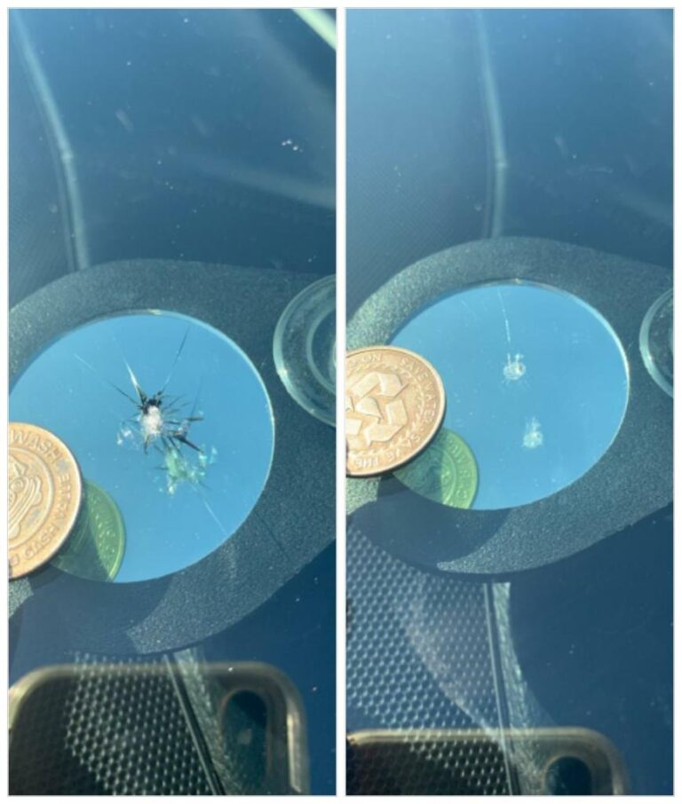 Windshield chip repair before and after comparison with quarter for size reference